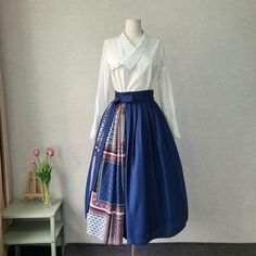 This is a Korean Modern Hanbok wrap style skirt for Women. This hanbok is modernly designed so you can wear it comfortably and beautifully. A pretty pattern accentuates this skirt for an unusual and sophisticated look. It has buttons on the side that open, so you can wear it comfortably without it falling open when you move. There is an elastic band in the waist part to make it more comfortable to wear. This modern hanbok is perfect dress for daily and celebrations such as parties or various events. ⭐Size recommendations S-M : Waist 25-27 inches L : Waist 28-30 inches For other sizes, please contact me for a custom order ⭐Please check out the link below for the white blouse the model in the photo is wearing. https://www.etsy.com/listing/1457605923/ 🟠 Decorate more stylishly with accessori Elegant Long Patchwork Skirt, Hanbok Sewing Pattern, Shabby Chic Outfits, Hanbok Skirt, Hanbok Women, Modern Hanbok Dress, Wrap Skirt Pattern, Casual Party Dress, Unusual Clothes