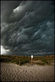 a storm is coming in over the beach