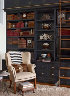 a living room filled with furniture and bookshelves covered in lots of bookcases