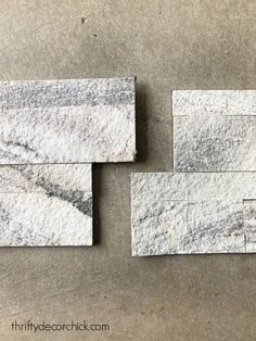 three pieces of white marble sitting next to each other