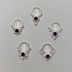 These are soooooo pretty. Made is 925 sterling silver with tribal details, set with a bright amethyst  stone. The rings are all 1cm (.40”) in diameter. The wire is 20 gauge.Stones shine light through them since the back is open. Hard to see this when they are lying flat in the pic. Each piece is made BY HANDOne of the images contains numbers to specify which you would like from the drop down menu. Spiritual Silver Amethyst Ring In Sterling Silver, Sterling Silver Body Jewelry, Silver Amethyst Ring, Spiritual Birthstone, Pierced Sterling Silver Belly Rings, Silver Sterling Belly Rings, Silver Amethyst Bohemian Ring, Nickel-free Silver Amethyst Ring In Sterling Silver, Silver Spiritual Amethyst Ring, Bohemian Silver Amethyst Ring In Sterling Silver