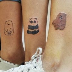 three small tattoos on the legs of two people with bears and pandas tattooed on them