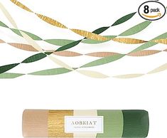 a roll of green and gold colored paper