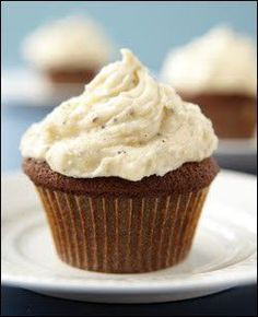 cupcakes with white frosting on a plate