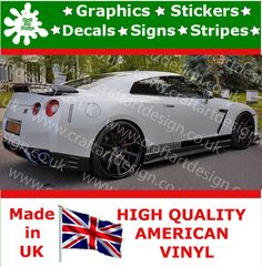 a white car with the british flag on it's bumper sticker is shown