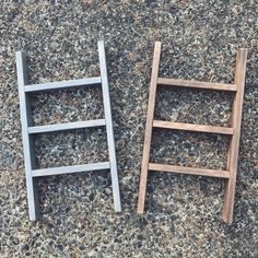 two ladders sitting on the ground next to each other