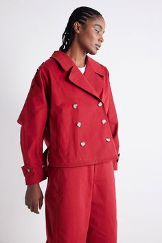 This oversized take on the Trench Coat coat is the perfect combination of practical and stylish, especially as a transitional coat from Summer to Fall. A stunning layering piece and effortless style statement. Double breasted Classic collar Button down closure Trendy Oversized Red Outerwear, Oversized Double-breasted Pea Coat, Chic Oversized Utility Jacket For Work, Red Oversized Outerwear With Buttons, Spring Oversized Double-breasted Pea Coat, Oversized Red Outerwear With Buttons, Oversized Utility Outerwear With Lapel Collar, Utility Oversized Outerwear With Lapel Collar, Red Single Breasted Cotton Outerwear