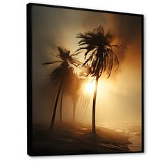 the sun is setting behind two palm trees on the beach canvas wall art print in black frame