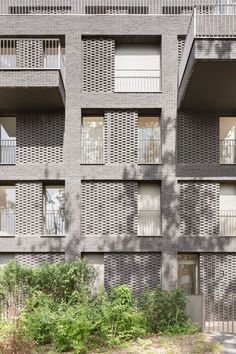 an apartment building with several balconies on each floor