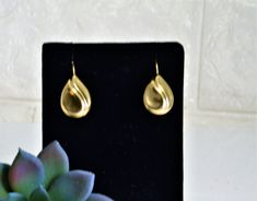 "Classic style with this pair of 14K Gold teardrop shaped earrings. Latch back closures. 2.7 grams Total weight of both. Stamped. 1\" drop. So beautiful! *IMPORTANT* Please see all pictures as they are a part of the description. Please read all measurements as the pictures can be deceiving in relation to size. Rocks, fake fruit, candles, books, shells or any other photo props are not included." Hypoallergenic Pear-shaped Teardrop Earrings For Formal Occasions, Yellow Gold Oval Teardrop Earrings For Formal, Yellow Gold Oval Teardrop Earrings For Formal Occasions, Formal Gold Teardrop Earrings With Lever Back, Yellow Gold Teardrop Earrings With Lever Back, Yellow Gold Teardrop Earrings With French Hook, Formal Yellow Gold Hypoallergenic Teardrop Earrings, Formal Teardrop Drop Earrings With French Hook, Formal Pear-shaped Teardrop Earrings With Lever Back