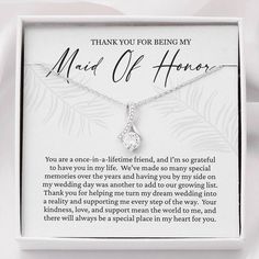 a white box with a necklace in it that says thank you for being my maid of honor