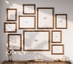 there are many frames on the wall with numbers