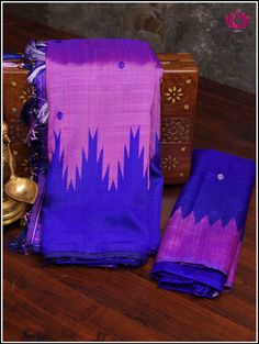 Berhampuri silk was introduced at Berhampur town in 14th century AD by the Mohuri Kings. It is known as ‘Silk City’ for its pure silk weaves. This Berhampuri silk saree is one of the traditional weaving and handloom heritage from Odisha. Embrace grace in this simple Berhampuri double pallu saree in purplish pink with Phoda kumba borders in blue. Extended pallu in altenate pink and Blue with small buttas adds elegance. Handmade custom tassels adds beauty to this classy pick. Blouse - Unstitched. Berhampuri Silk Saree, Purple Raw Silk Handloom Saree, Purple Tussar Silk Handloom Traditional Wear, Purple Handloom Tussar Silk Blouse Piece, Purple Handloom Tussar Silk Traditional Wear, Purple Handloom Tussar Silk Saree, Navratri Katan Silk Saree With Woven Motifs, Purple Paithani Silk Handloom Blouse Piece, Festive Tussar Silk Handloom Saree