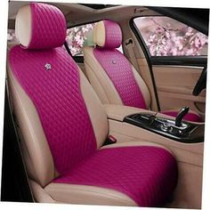 the interior of a car with pink cloth and brown leather trims, including two front seats