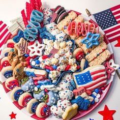 a plate full of patriotic cookies and treats