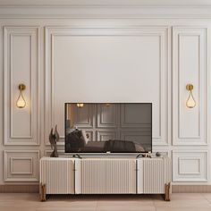 a large flat screen tv sitting on top of a wooden cabinet in a living room