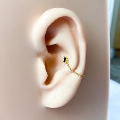 an ear with a chain attached to it