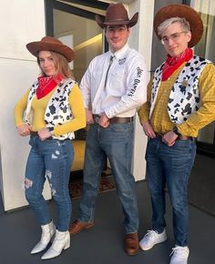 three people in cowboy hats and jeans posing for the camera with their hands on their hipss