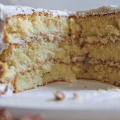 a close up of a cake on a plate with one slice taken out of it