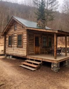 a small log cabin in the woods with steps leading up to it's porch