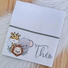 a close up of a piece of cloth with animals on it and the word'thee '