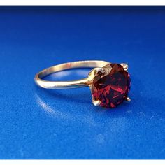 * Vintage Designer 14k Yellow Gold Round Red Quartz Solitaire January Ring * Ring Size: 6.0 * Top Of Ring Measures: 3/8" X 3/8" * Height: 3/8" * Band Measures: 1/16" * Red Quartz Total Carat Weight: Approximately 1.80 Tcw * Weight: 2.3 Tgw * Marked: 14k*Makers Mark * Condition: Great * G1059 Classic Red Gemstone Jewelry, Red Brilliant Cut Birthstone Ring As Gift, Red Brilliant Cut Birthstone Ring For Gift, Classic Red Jewelry With Lab-created Ruby, Classic Red Lab-created Ruby Jewelry, Classic Red Ruby Jewelry, Classic Round Band Lab-created Ruby Jewelry, Classic Lab-created Ruby Round Band Jewelry, Fine Jewelry Red Birthstone Ring With Brilliant Cut