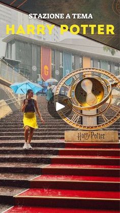 a woman walking up some steps with an umbrella in her hand and the words harry potter on it