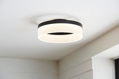 a white and black ceiling light in a room