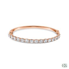 This Oval Diamond Bangle features an exquisite oval-shaped diamond set in a timeless design. Perfectly suited for any occasion, this stunning piece is sure to be treasured for years to come. The standard size is 7 inches; please note any other sizes are considered special order and may require additional time for production. Petite Engagement Ring, Diamond Bangle, Diamond Set, Emerald Diamond, Oval Diamond, Antique Rings, Eternity Bands, Earring Gifts, Wedding Ring Bands