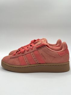 Spice up your sneaker game with these pink Adidas Campus 00s in size 9.5 for women. These shoes boast a stylish suede upper material with a classic Adidas design that includes the iconic three stripes. The sneaker features a comfortable fit and an athletic style that is perfect for anyone looking to add a pop of color to their wardrobe. Whether you're going for a casual look or dressing up for a night out, these shoes are a great addition to your collection. Get ready to turn heads and step out in style with these Adidas Campus 00s! Pink And Brown Shoes, Pink Adidas Campus, Adidas Campus 00s, Adidas Design, Classic Adidas, Athletic Style, Adidas Campus, Shoe Inspo, Sneaker Games