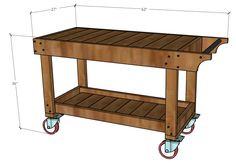 a wooden table with wheels on it and measurements for the top portion of the table