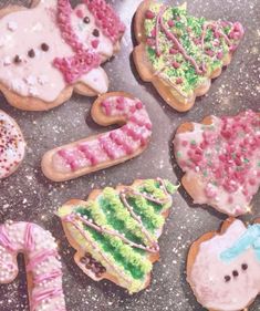 decorated cookies are arranged in the shape of animals