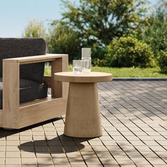 a chair and table sitting on a patio