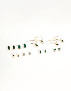 Up your ear stack with a burst of vibrant emerald green from this set of 8 earrings. Featuring baguette cuts, pear-shaped diamantes, sleek designs, and sparkling crystals, these pieces add a striking touch of color and sophistication to any ensemble. Material: Crystal Color: Green Dimensions: Length 19 mm x Width 19 mm Feature Dimensions: Attachment Width: 5 mm | Lovisa Gold Emerald Stone Earrings 8-Pack Earring Stack, Ear Stack, Emerald Stone, Baguette Cut, Sparkling Crystal, Stone Earrings, Christmas List, Pear Shaped, Emerald Green