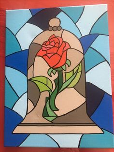 a painting of a bell with a rose on it and blue stained glass behind it