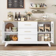 a coffee shop with white cabinets and shelves