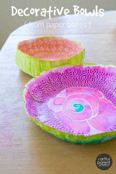 two paper bowls sitting on top of a wooden table with text overlay that reads decorative bowls from paper plates