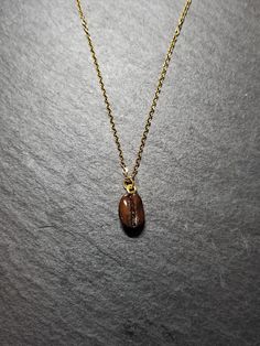 This beautiful necklace is a wonderful idea for gift giving and as a little gift for yourself. The coffee bean is approximately 11mm x 8mm. Please choose your chain length preference in the drop down box. See more jewellery here: https://www.etsy.com/shop/simplysweetjewellery I'm happy to help you find what you're looking for! Please feel free to message me with any questions. Thank you for shopping at Simply Sweet Jewellery! PLEASE NOTE: Colours may not look the same as on your computer - Avoid Nickel-free Brown Necklace For Gift, Personalized Brown Necklace For Gift, Minimalist Brown Necklaces For Gifts, Minimalist Brown Necklace For Gifts, Minimalist Brown Necklace For Gift, Handmade Coffee Colored Jewelry For Gifts, Handmade Coffee-colored Jewelry For Gift, Bean Necklace, Sweet Jewelry