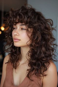 The Best Butterfly Haircut Ideas for Girls Stacked Layers Curly Hair, Curly Bangstyle Hair Long, Curly Shag With Bangs Over 40, Layered Short Curly Hair, Shaggy Haircuts Curly Hair, Shaggy Curly Hair Long, Short Curly Shag Haircut, Shaggy Curly Hair Medium, Curly Hair Shag Haircut