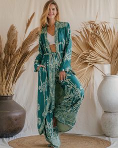 Our Aphrodite Original Kaftan, made from soft viscose double gauze fabric, offers a luxurious feel and an ethereal appearance. Designed to enhance your presence in any setting, its flowing silhouette and lightweight, breathable fabric ensure a graceful and comfortable fit. Ideal for lounging by the pool or attending special events, this piece is perfect for making a statement. Its versatile design provides multiple styling options, making it an indispensable addition to your wardrobe. Celebrate your divine beauty and radiate grace with our reversible Original Kaftan Bohemian Silk Robe For Loungewear, Silk Bohemian Robe For Loungewear, Bohemian Maxi Length Robe For Loungewear, Flowy Silk Maxi Length Kimono, Bohemian Open Front Robe For Daywear, Flowy Tunic Kimono For Loungewear, Bohemian Rayon Kimono For Loungewear, Flowy Long Kimono For Loungewear, Bohemian Style Rayon Kimono For Loungewear