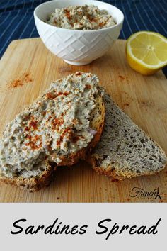 two slices of bread sitting on top of a cutting board next to a bowl of food