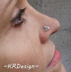 "Welcome :) This is a hand crafted, .925 sterling silver, Triskele nose stud with a 5x5mm \"L\" post.The diameter of the design is 5mm. Meaning of the Triskele: life-death-rebirth, spirit-mind-body, mother-father-child, past-present-future, power-intellect-love and creation-preservation-destruction to name but a few ~ You can also request it with a oxidized (blackened) style. I can also make it for you in 14K white gold, please send me a request for a custom order if you interested. Helpful Sugg Custom Nose Ring, Triangle Nose, Silver Nose Stud, L Post, Tragus Jewelry, Tragus Stud, Silver Nose Ring, Piercing Shop, Witch Jewelry