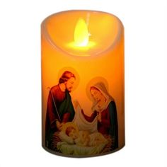 a lit candle with an image of the virgin mary and baby jesus on it's side