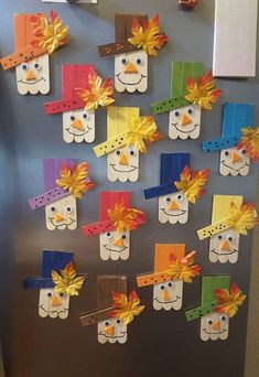 a refrigerator decorated with construction paper faces