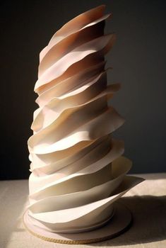 a stack of folded paper sitting on top of a table