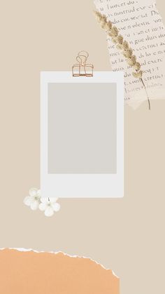 an empty photo frame on top of a piece of paper