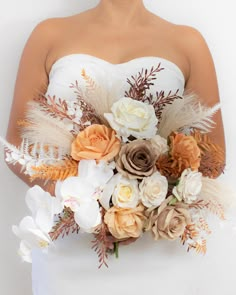 a woman in a white dress holding a bouquet of flowers on her wedding day with feathers