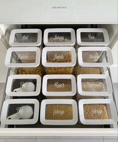 an open refrigerator with twelve containers containing different foods in it's door and labels on the doors