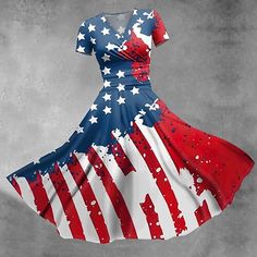 a dress with an american flag pattern on it is flying through the air in front of a gray background