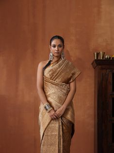 Experience the luxurious elegance of our Katan Silk Tanchoi Sarees, handcrafted with intricate Banarasi designs and premium Katan silk fabric. Available in a range of colors and styles, these sarees are the perfect choice for any special occasion The model is wearing blouse for styling purposes only. Luxury Katan Silk Fabric With Zari Embroidery, Luxury Unstitched Katan Silk Sets, Luxury Katan Silk Saree For Eid, Luxury Orange Katan Silk Saree, Luxury Katan Silk Saree With Cutdana Detailing, Luxury Katan Silk Unstitched Saree Suit, Cheap Unstitched Katan Silk Traditional Wear, Luxury Handloom Banarasi Silk Fabric, Luxury Katan Silk Fabric With Pallu Detail